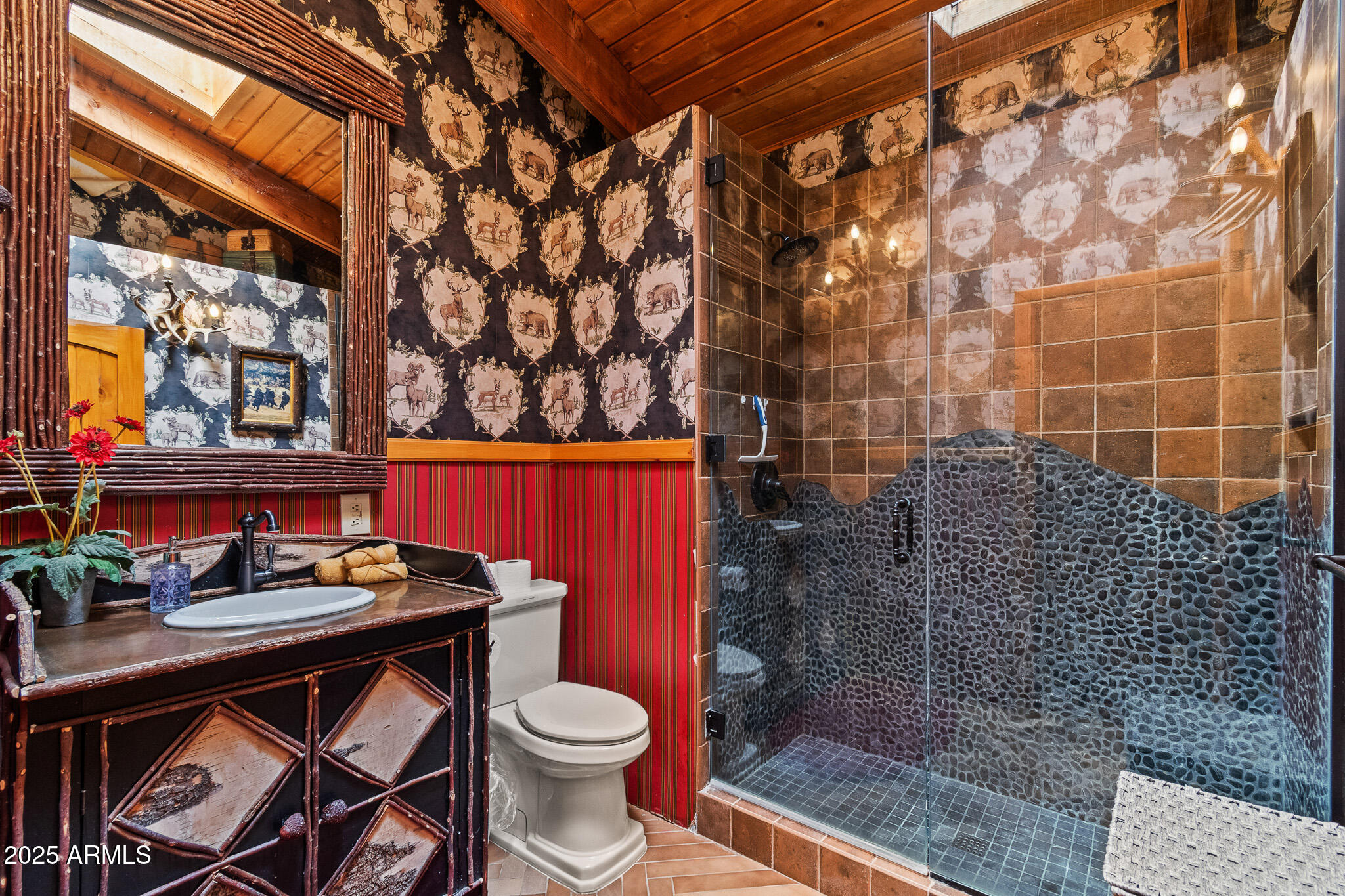 2948 Wildcat Trail Overgaard, AZ 85933 - Photo 9 of 38 a bathroom with a sink a toilet and shower