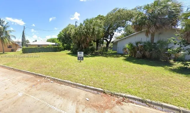 a swimming pool with some trees in the background
