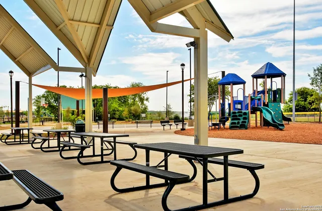a view of swimming pool with outdoor seating and furniture
