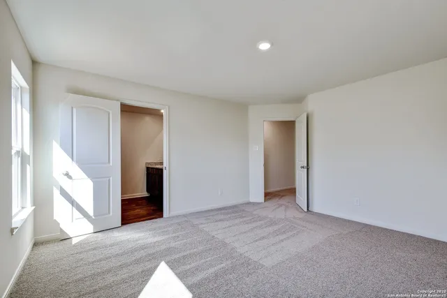 a view of an empty room and window