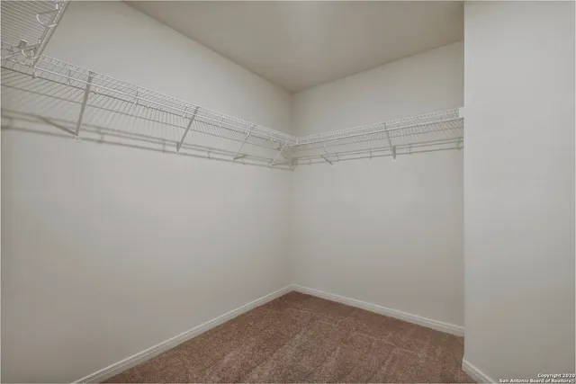 a view of a room with racks on the wall