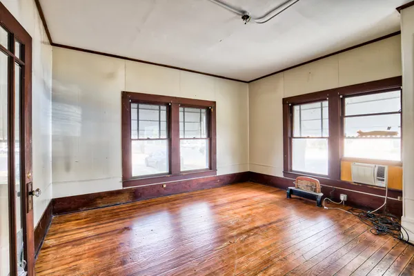a view of room with window and hardwood floor