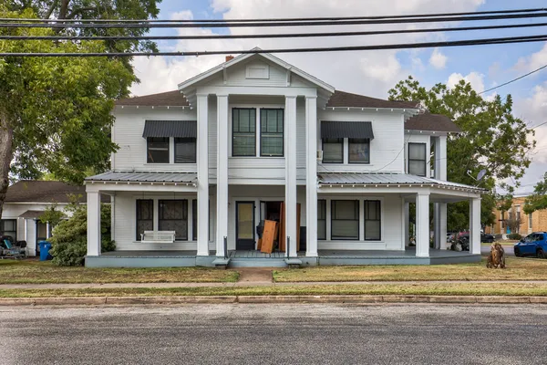 a view of a house with a swimming pool
