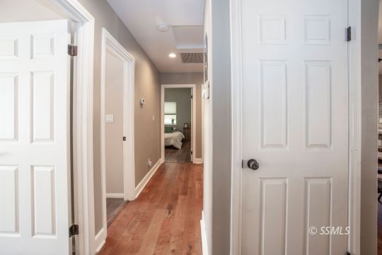 421 Christopher Court Ridgecrest, CA 93555 - Photo 20 of 50 a view of a hallway with a wooden door