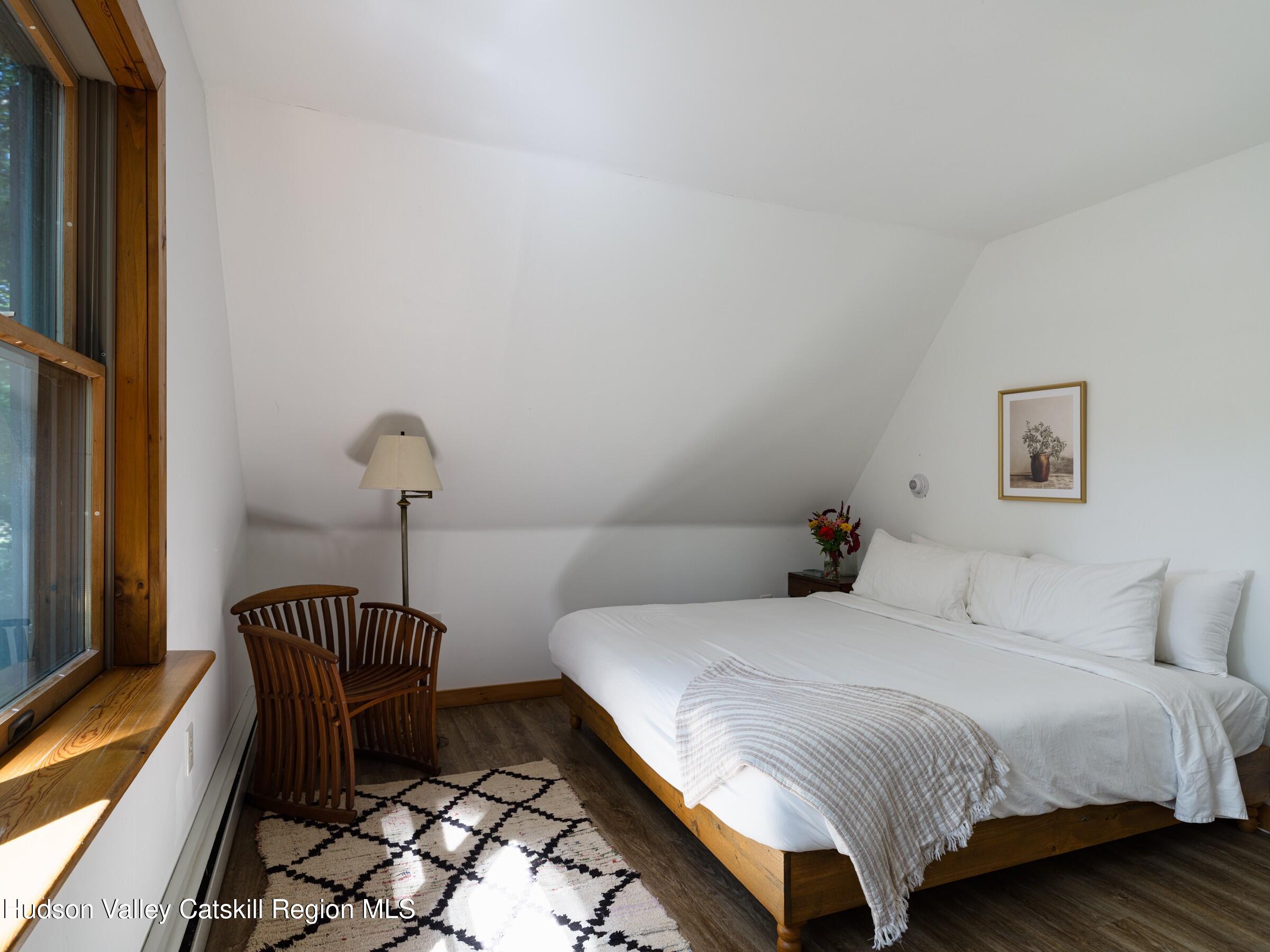 106 Tick Tock Way Stanfordville, NY 12581 - Photo 12 of 22 a bedroom with a bed and a mirror