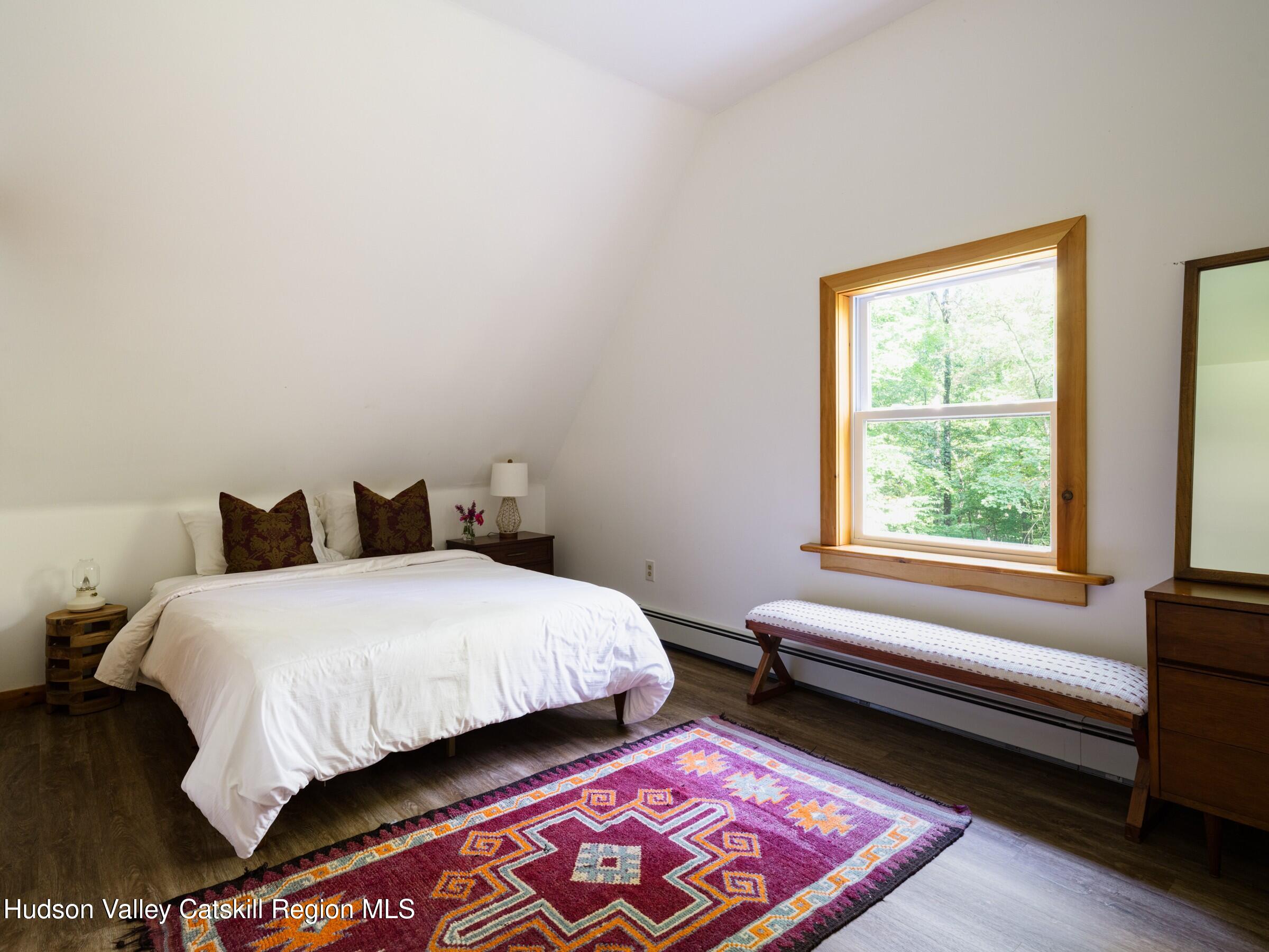 106 Tick Tock Way Stanfordville, NY 12581 - Photo 14 of 22 a bedroom with bed and window