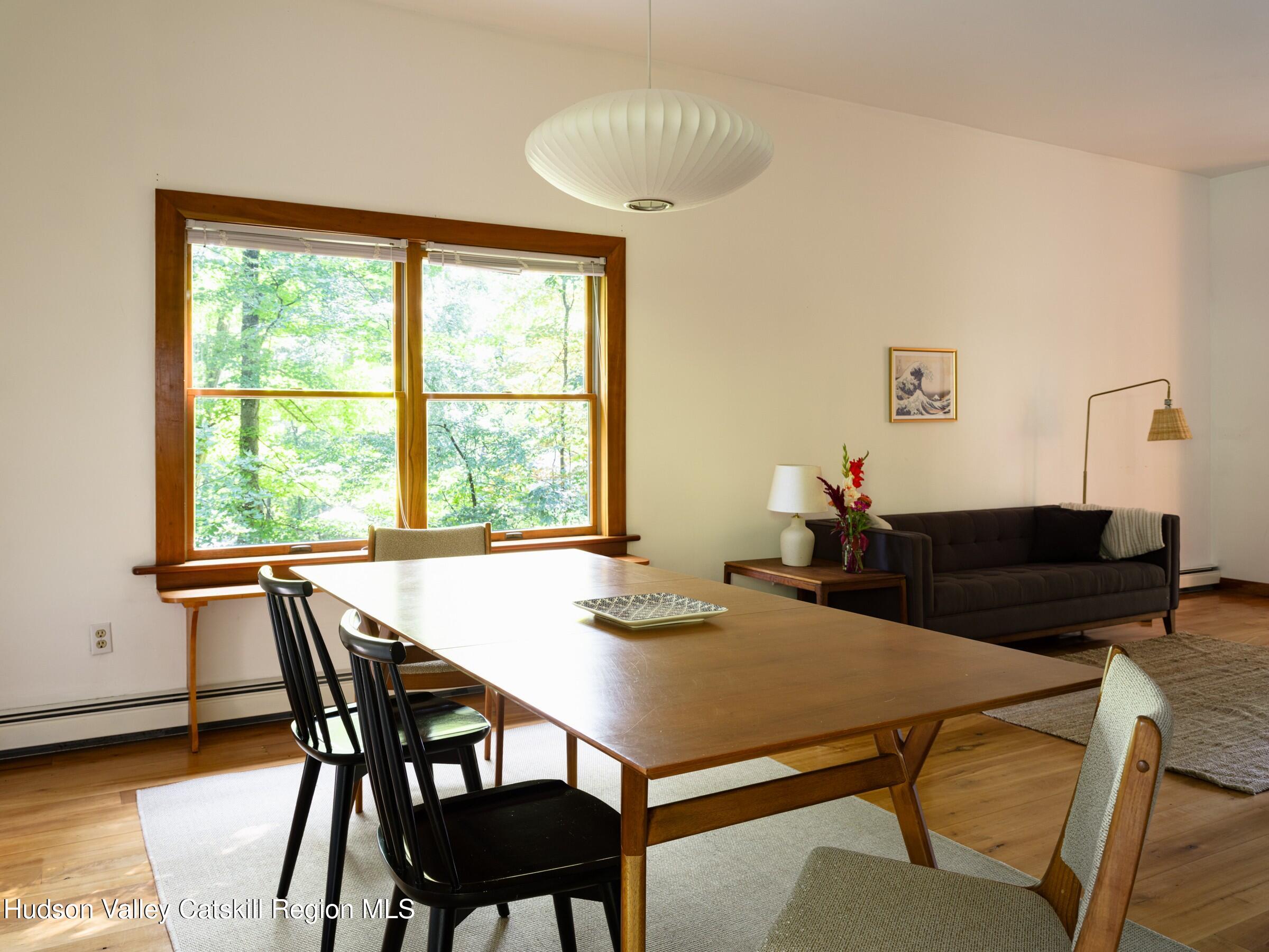 106 Tick Tock Way Stanfordville, NY 12581 - Photo 7 of 22 a view of a dining room with furniture and window