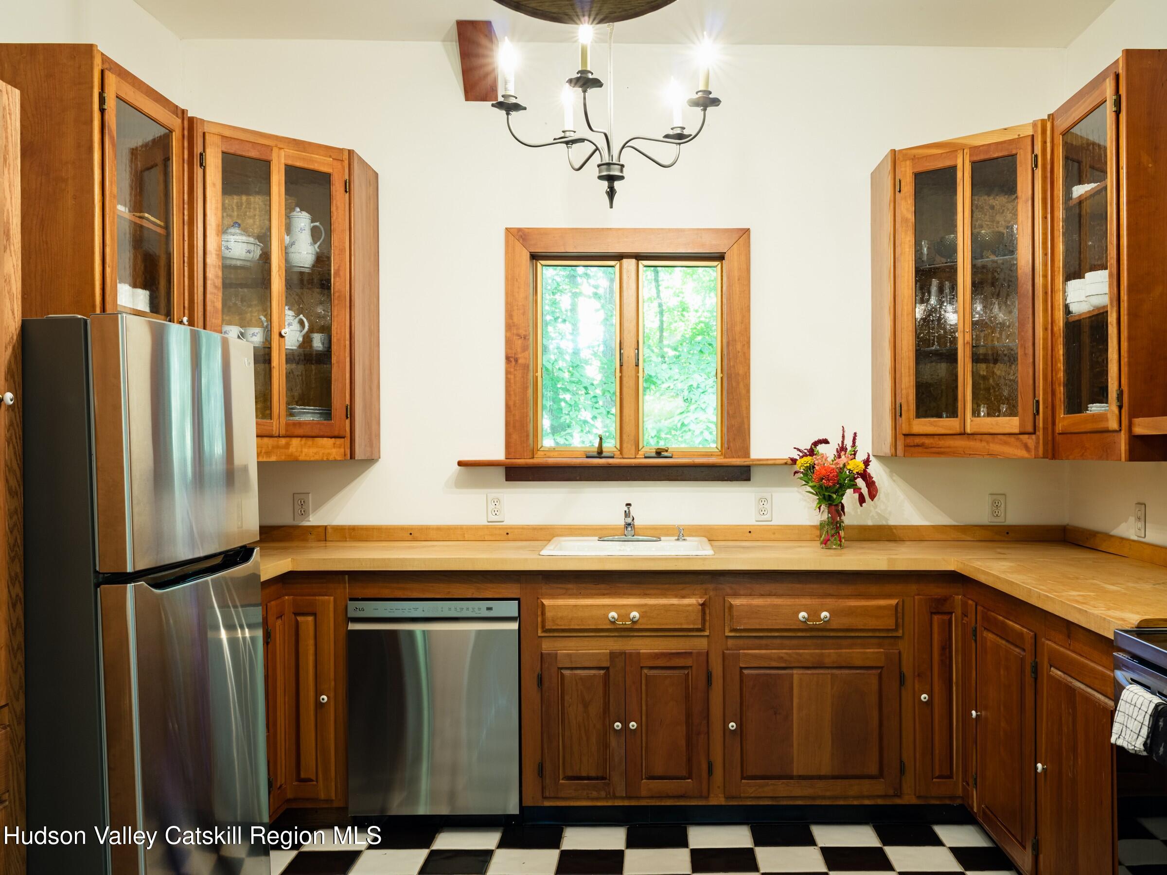 106 Tick Tock Way Stanfordville, NY 12581 - Photo 8 of 22 a kitchen with stainless steel appliances granite countertop a sink and a refrigerator
