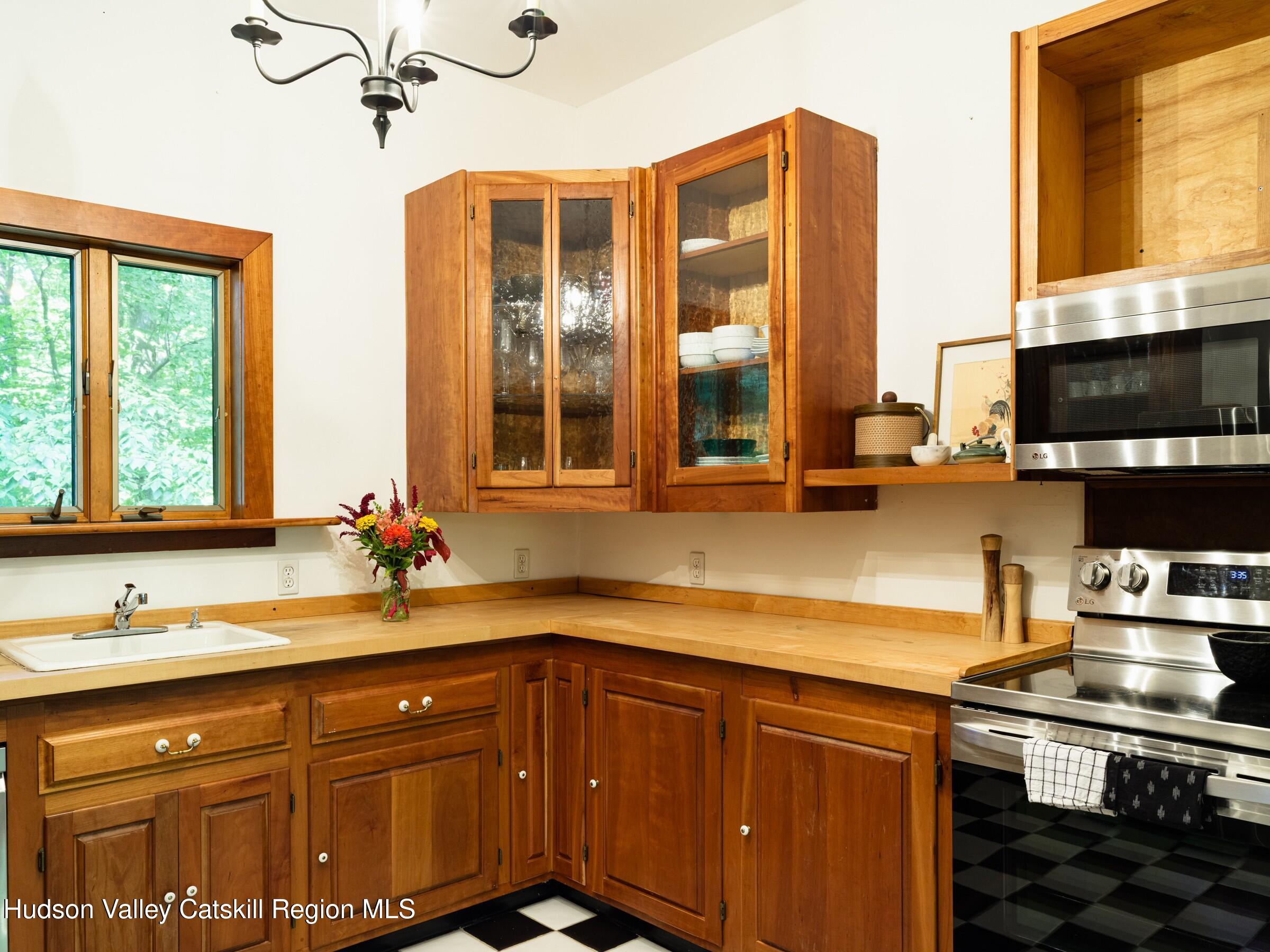 106 Tick Tock Way Stanfordville, NY 12581 - Photo 9 of 22 a kitchen with stainless steel appliances a sink stove and cabinets