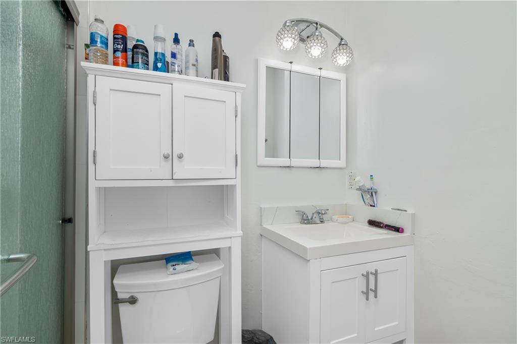 5350 Catts Street Naples, FL 34113 - Photo 12 of 21 a bathroom with a sink and a vanity
