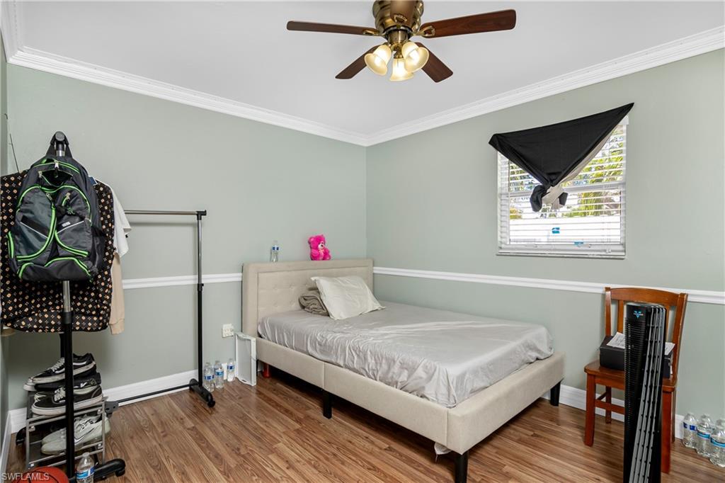 5350 Catts Street Naples, FL 34113 - Photo 14 of 21 a bedroom with a bed and a window