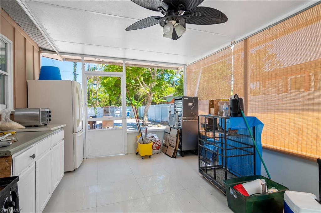 5350 Catts Street Naples, FL 34113 - Photo 17 of 21 a living room with furniture and a large window