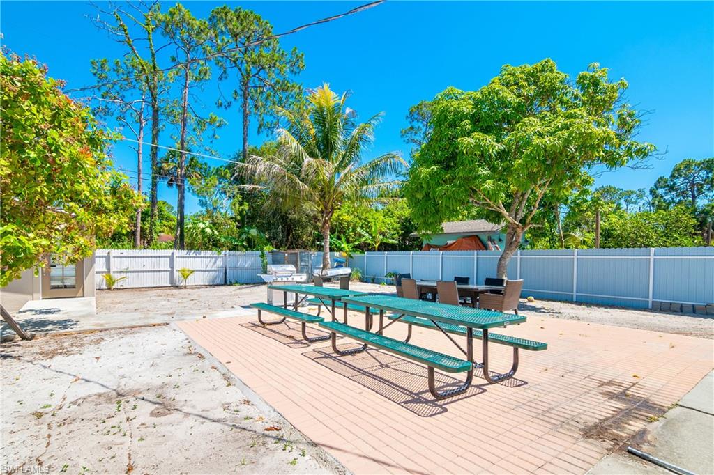 5350 Catts Street Naples, FL 34113 - Photo 19 of 21 a view of a chairs and tables in the patio