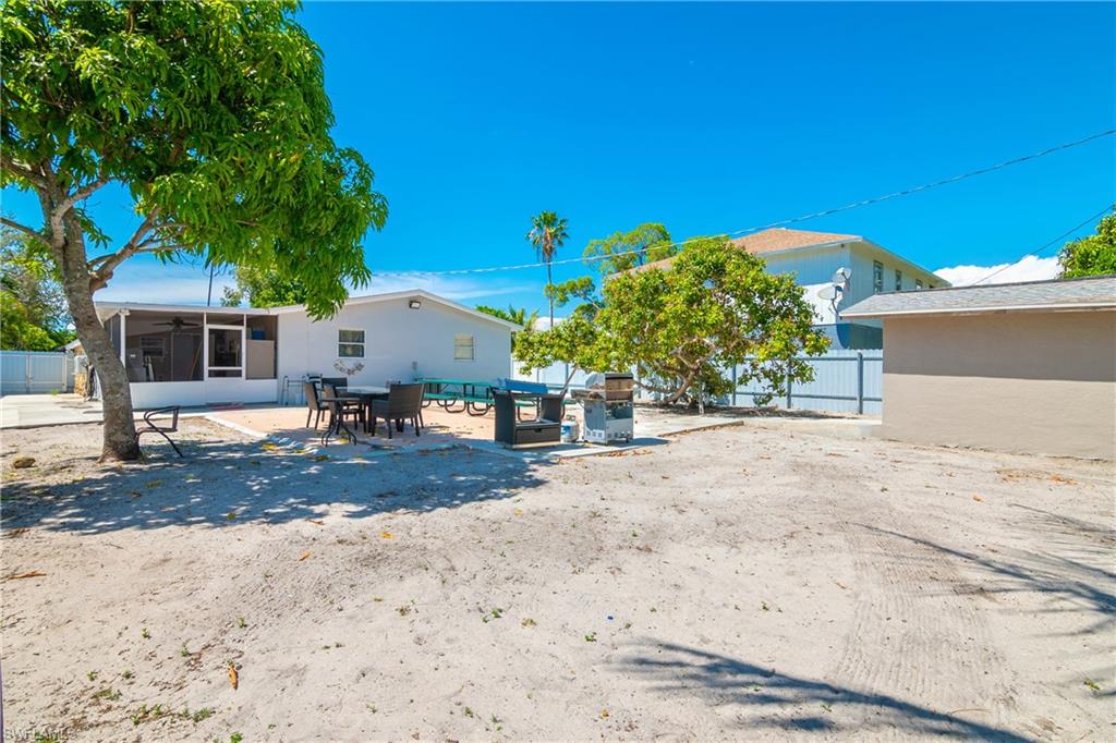 5350 Catts Street Naples, FL 34113 - Photo 21 of 21 a backyard of a house with a tree
