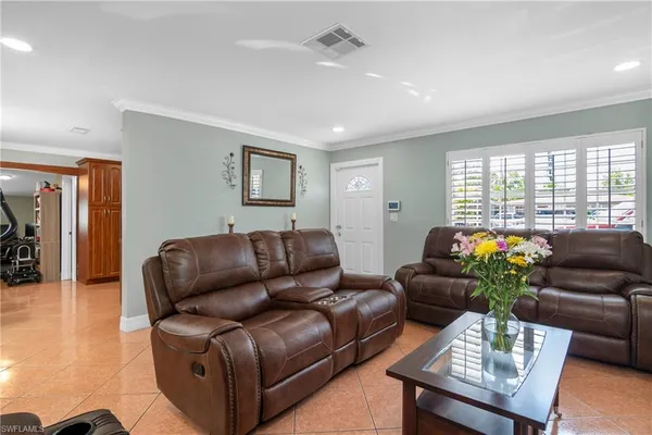a living room with furniture and a window