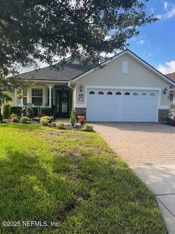 a view of a house with backyard porch and sitting area