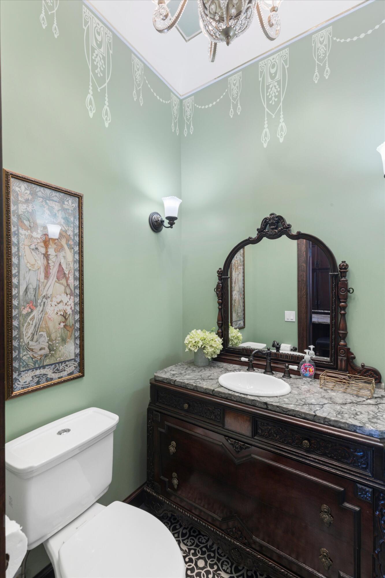 512 Amelia Street Key West, FL 33040 - Photo 22 of 52 a bathroom with a toilet sink and mirror