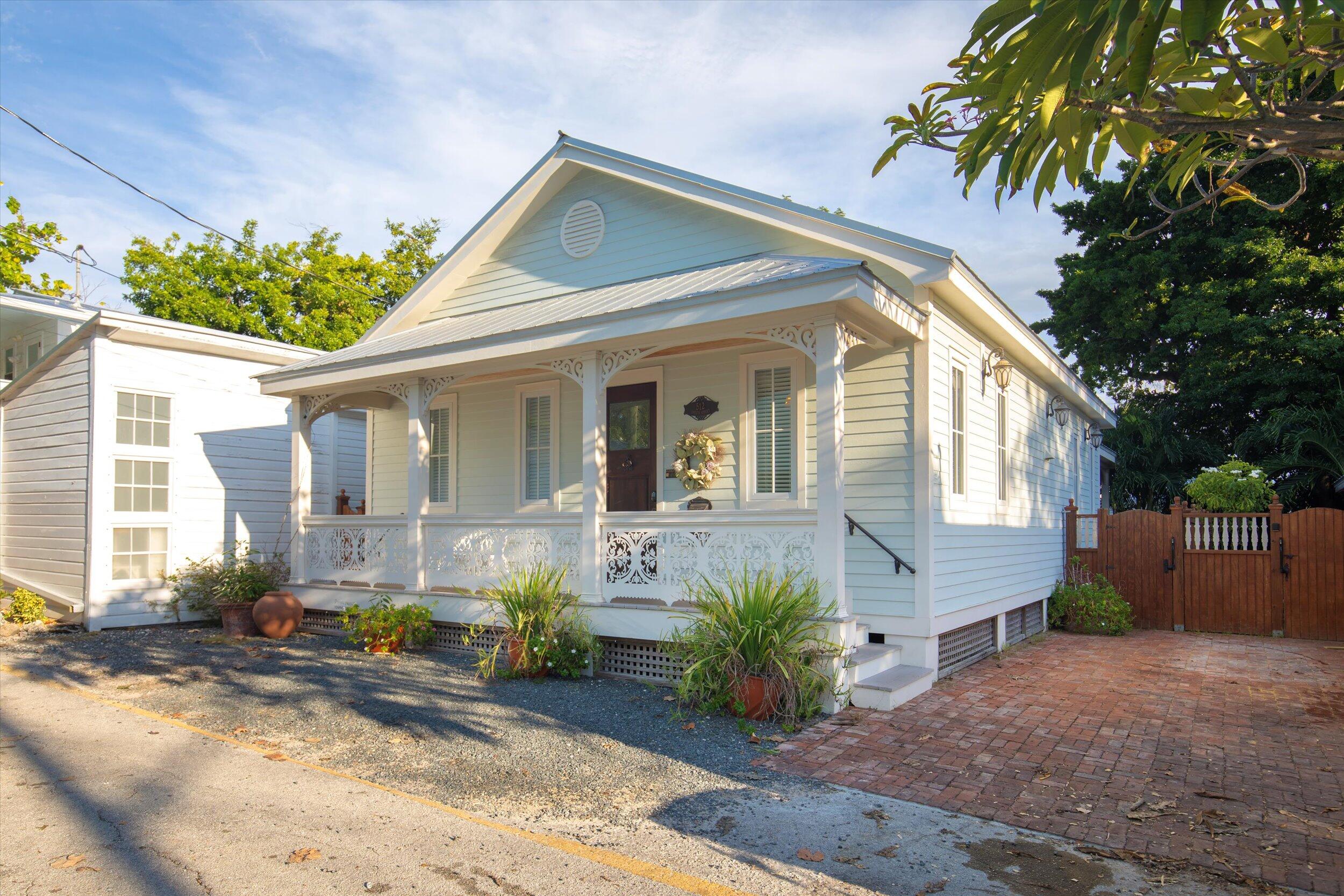512 Amelia Street Key West, FL 33040 - Photo 3 of 52 a front view of a house with garden