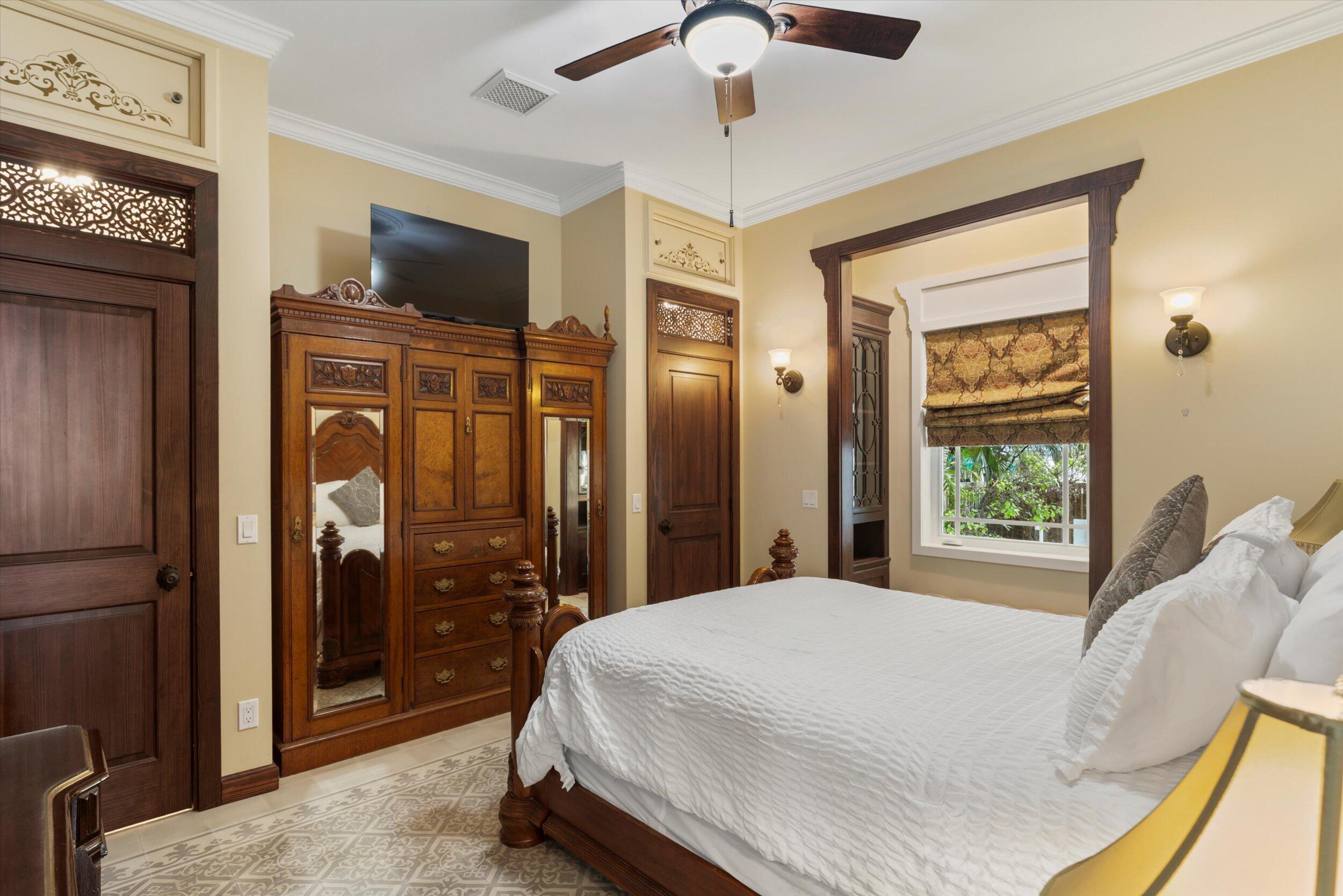 512 Amelia Street Key West, FL 33040 - Photo 35 of 52 a bed sitting in a bedroom next to a window