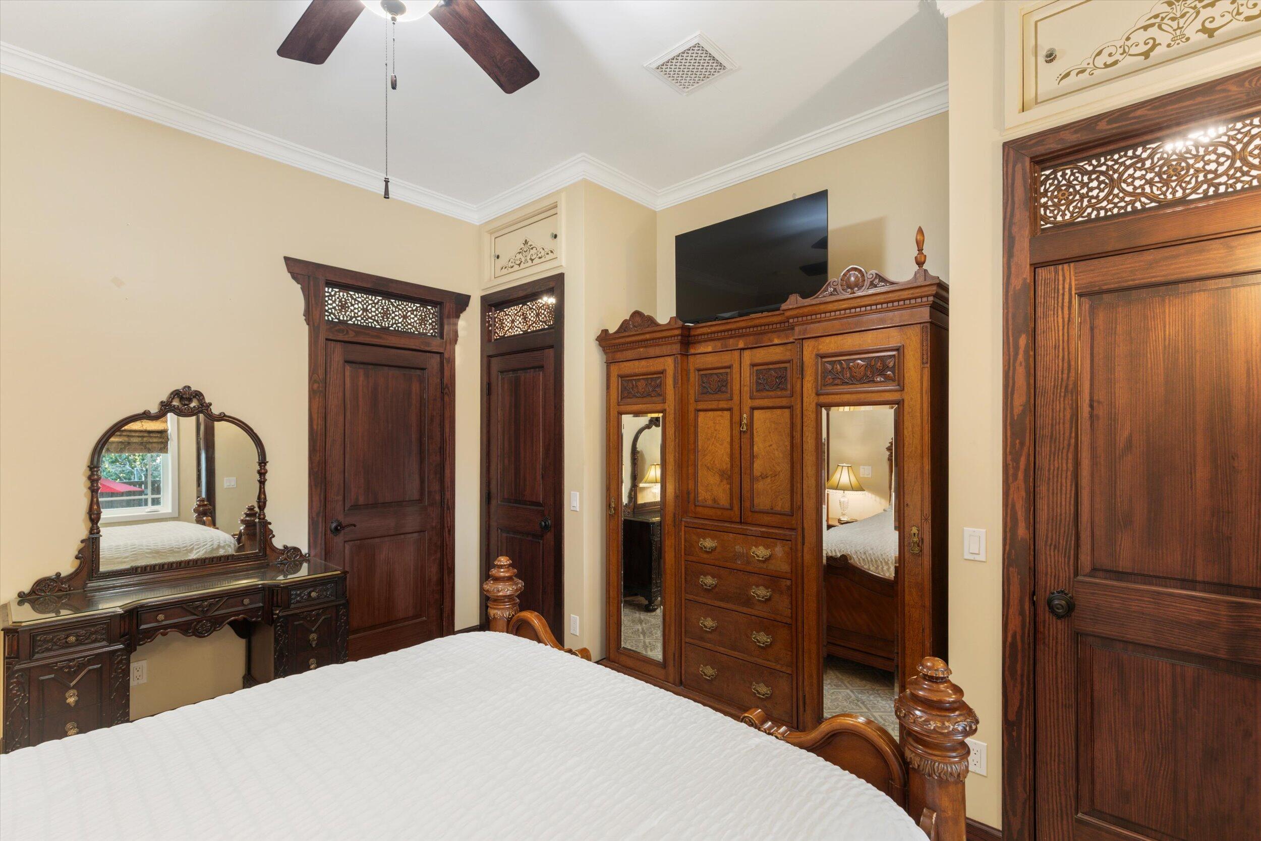 512 Amelia Street Key West, FL 33040 - Photo 40 of 52 a bedroom with a bed and a flat screen tv