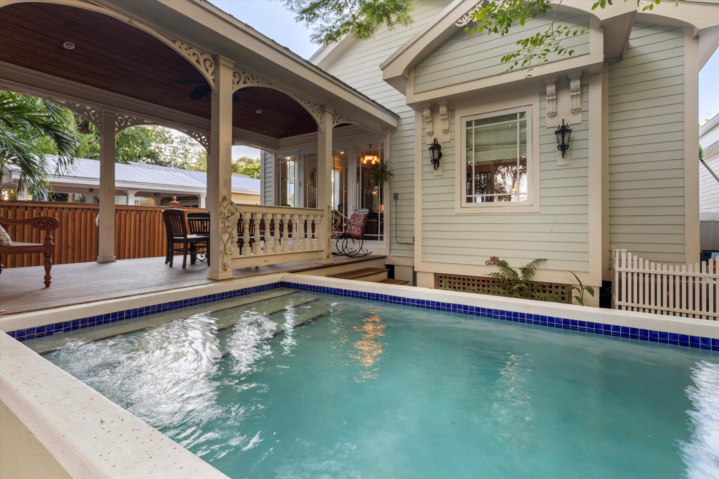 512 Amelia Street Key West, FL 33040 - Photo 49 of 52 a view of a patio with swimming pool table and chairs