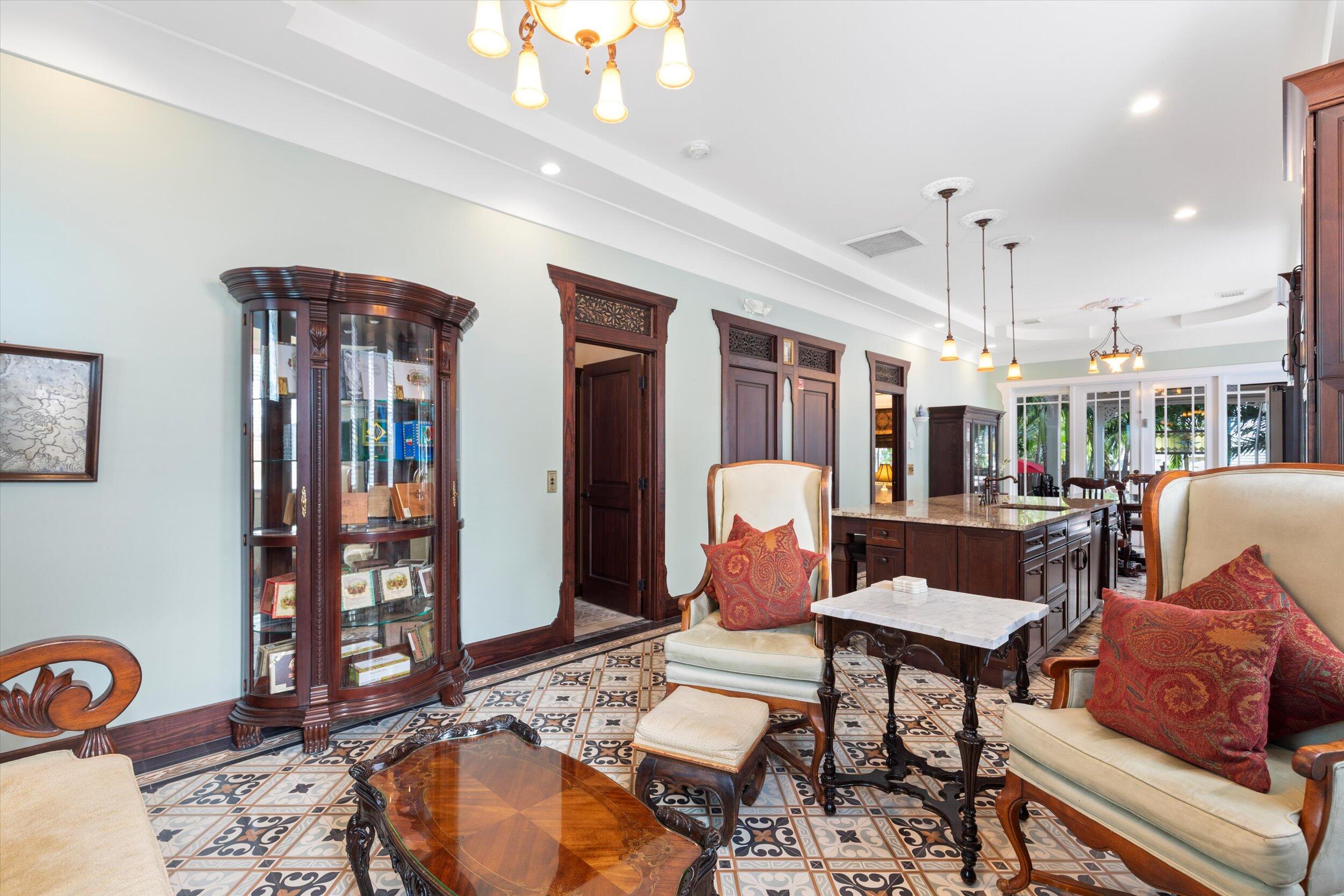 512 Amelia Street Key West, FL 33040 - Photo 8 of 52 a living room with furniture a rug and a chandelier