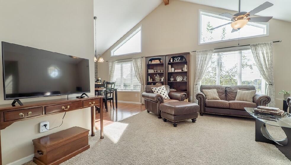 9166 Maple Court St. John, IN 46373 - Photo 11 of 40 a living room with furniture and a flat screen tv