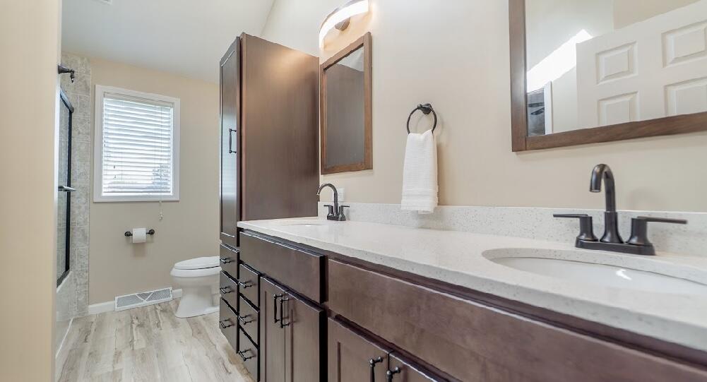 9166 Maple Court St. John, IN 46373 - Photo 16 of 40 a bathroom with a sink and a toilet