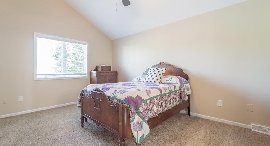 9166 Maple Court St. John, IN 46373 - Photo 20 of 40 a bedroom with a bed and a window