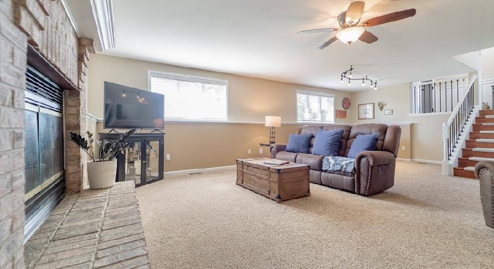 9166 Maple Court St. John, IN 46373 - Photo 22 of 40 a living room with furniture and a flat screen tv