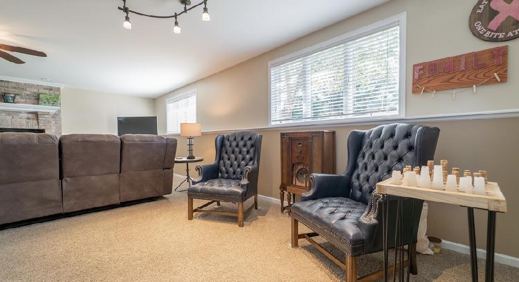 9166 Maple Court St. John, IN 46373 - Photo 23 of 40 a living room with furniture and a large window