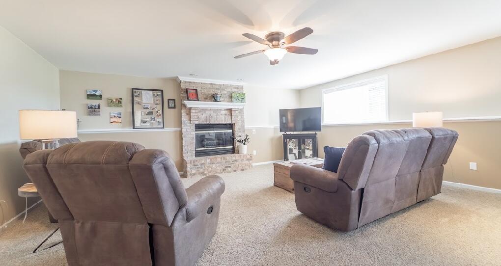 9166 Maple Court St. John, IN 46373 - Photo 24 of 40 a living room with furniture and a flat screen tv