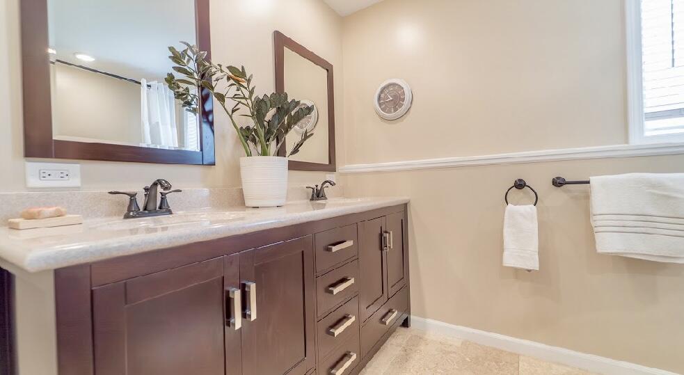 9166 Maple Court St. John, IN 46373 - Photo 25 of 40 a bathroom with a sink and a mirror