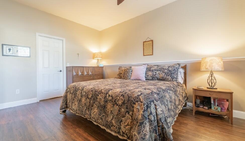 9166 Maple Court St. John, IN 46373 - Photo 29 of 40 a bedroom with a bed and a mirror