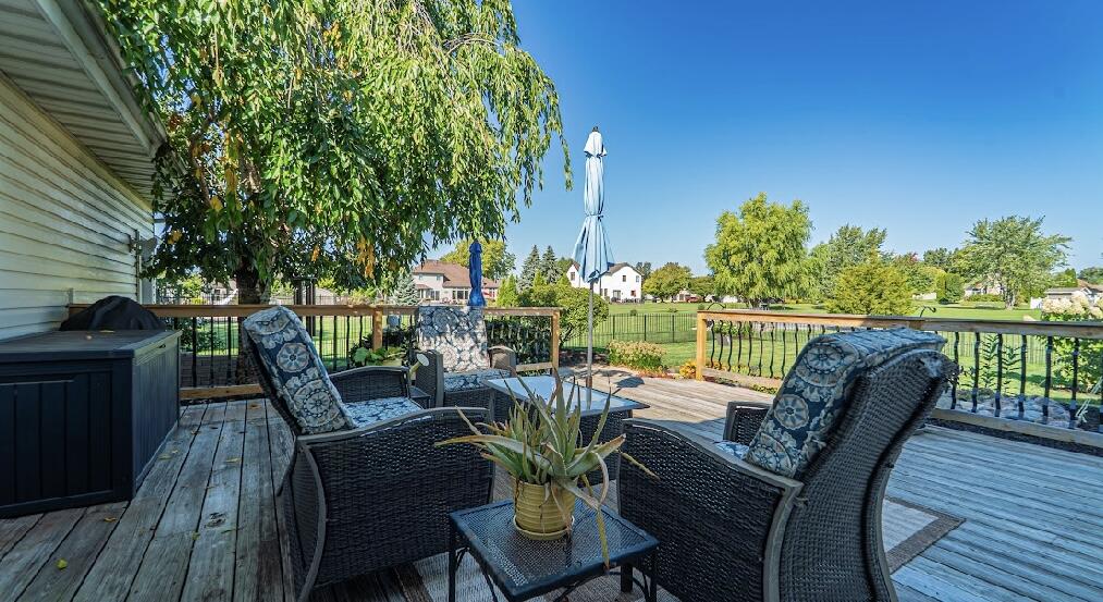 9166 Maple Court St. John, IN 46373 - Photo 37 of 40 a view of a chairs and table in patio with potted plants