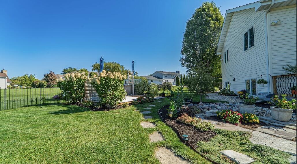 9166 Maple Court St. John, IN 46373 - Photo 38 of 40 a view of a garden with plants and large trees