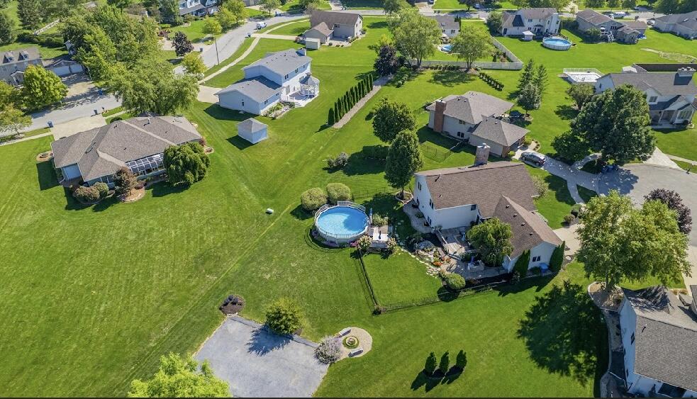 9166 Maple Court St. John, IN 46373 - Photo 4 of 40 an aerial view of residential house with an outdoor space and seating