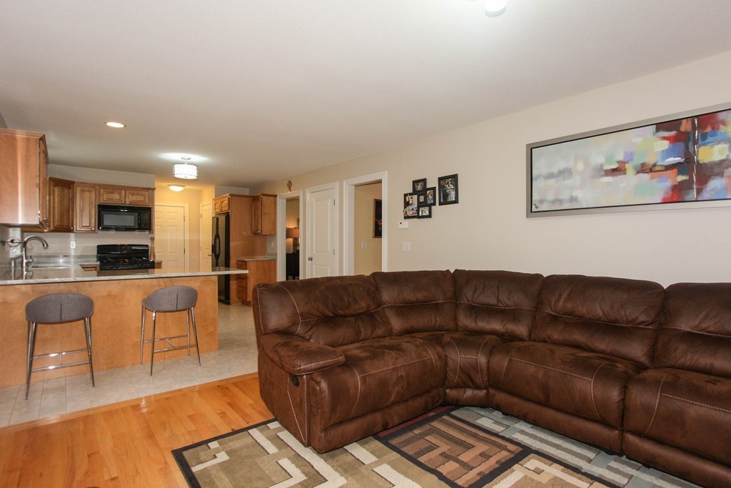 49 Chester Street West Springfield, MA 01089 - Photo 12 of 25 a living room with furniture and a view of kitchen