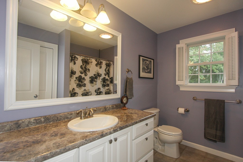 49 Chester Street West Springfield, MA 01089 - Photo 17 of 25 a bathroom with a granite countertop sink toilet and a mirror
