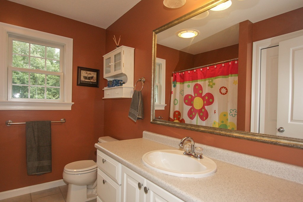49 Chester Street West Springfield, MA 01089 - Photo 20 of 25 a bathroom with a sink and a mirror