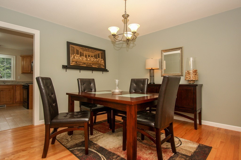 49 Chester Street West Springfield, MA 01089 - Photo 9 of 25 a view of a dining room with a table and chairs