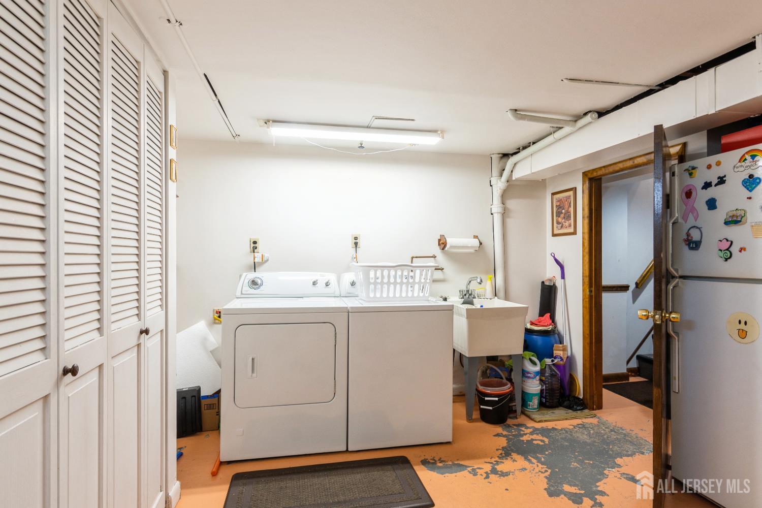157 Orange Street Edison, NJ 08817 - Photo 16 of 19 a utility room with dryer and washer