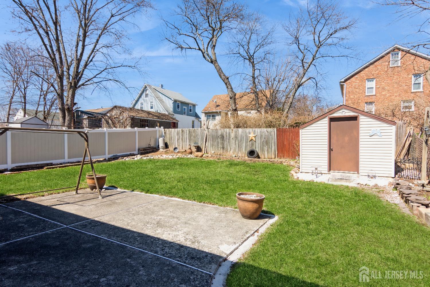 157 Orange Street Edison, NJ 08817 - Photo 19 of 19 a house with green field in front of it