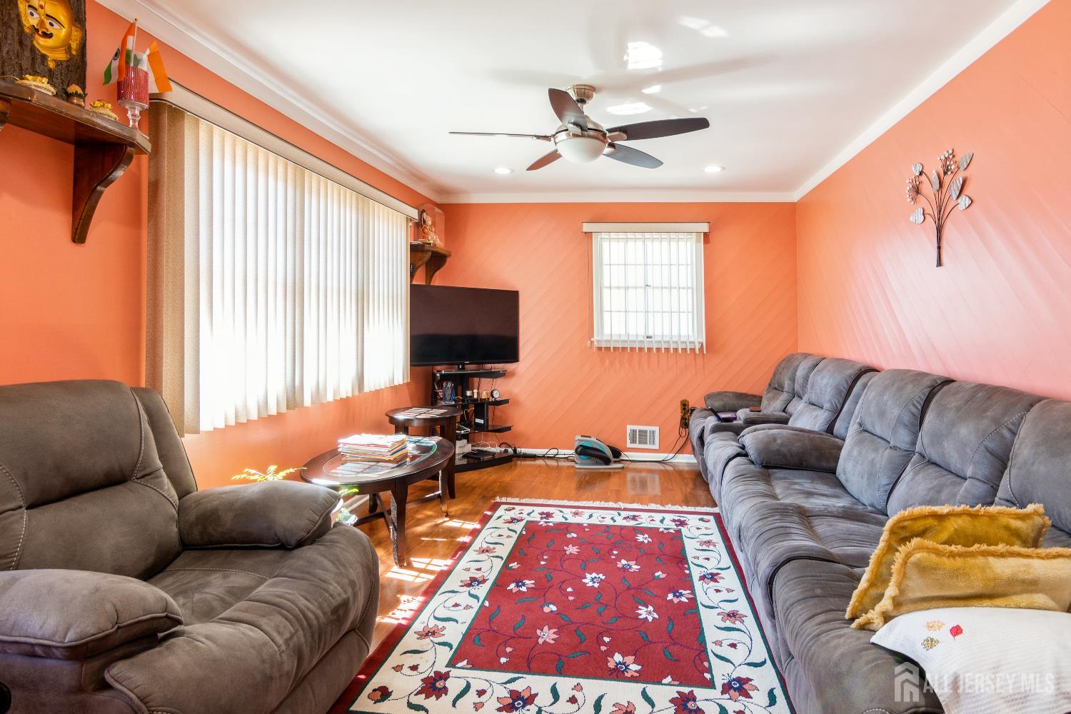 157 Orange Street Edison, NJ 08817 - Photo 3 of 19 a living room with furniture and a flat screen tv