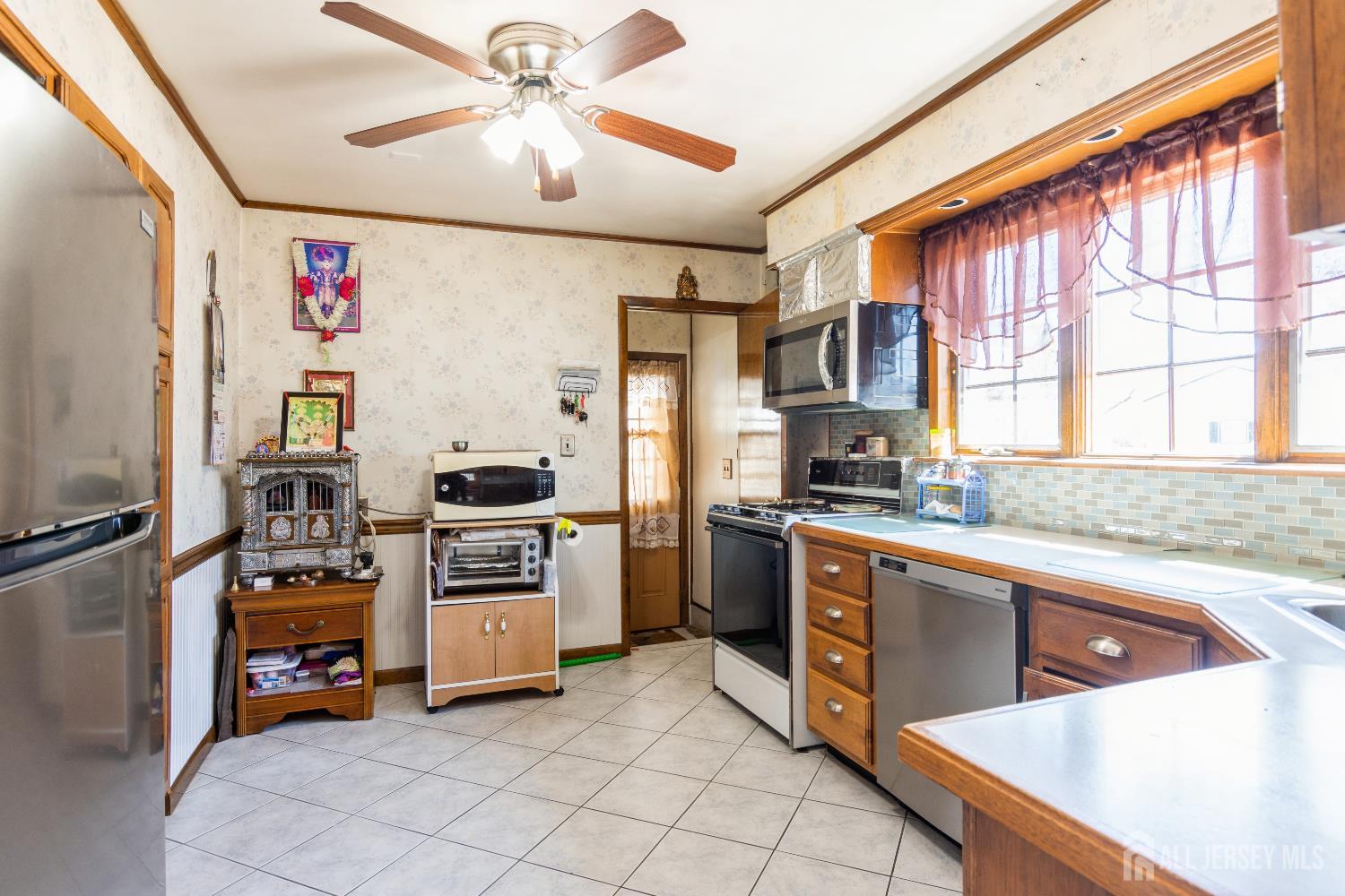 157 Orange Street Edison, NJ 08817 - Photo 5 of 19 a kitchen with stainless steel appliances granite countertop a stove and a refrigerator