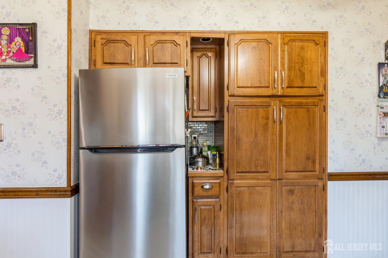157 Orange Street Edison, NJ 08817 - Photo 7 of 19 a white refrigerator freezer sitting in a kitchen