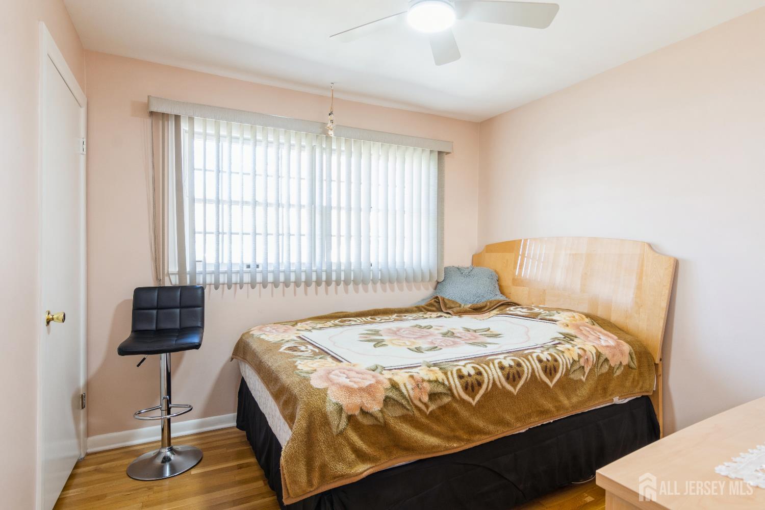 157 Orange Street Edison, NJ 08817 - Photo 9 of 19 a bed sitting in a bedroom next to a window