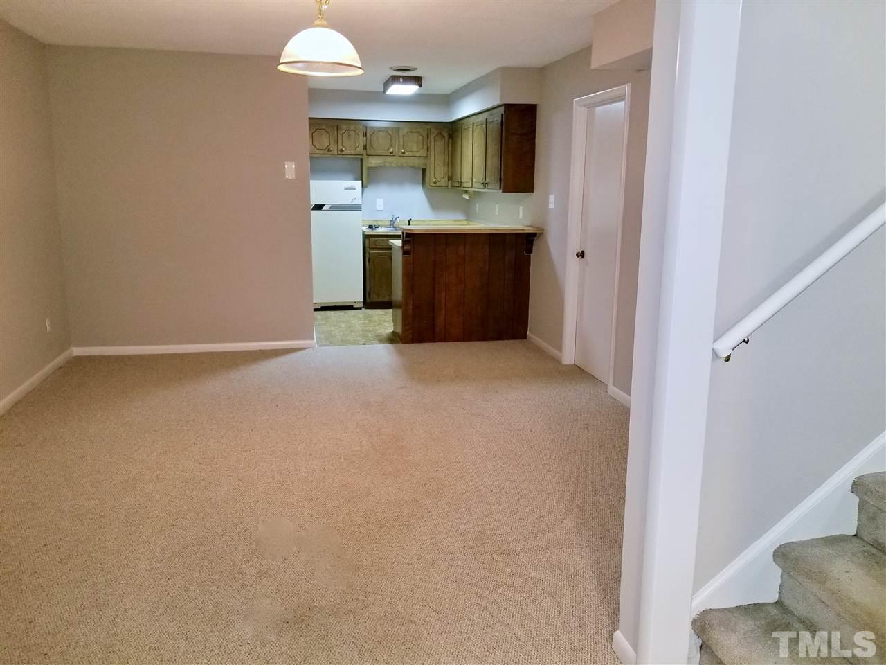 6420 Rockrest Court Raleigh, NC 27612 - Photo 11 of 22 Basement living area w/ private rear exterior entry just to the left of this picture