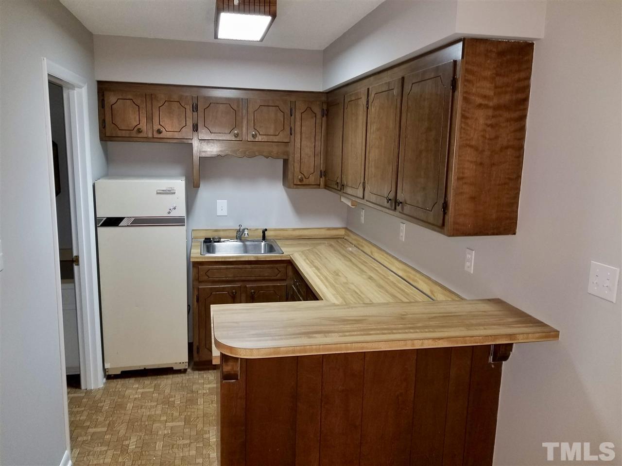 6420 Rockrest Court Raleigh, NC 27612 - Photo 12 of 22 Basement kitchen helps create the perfect in-law suite