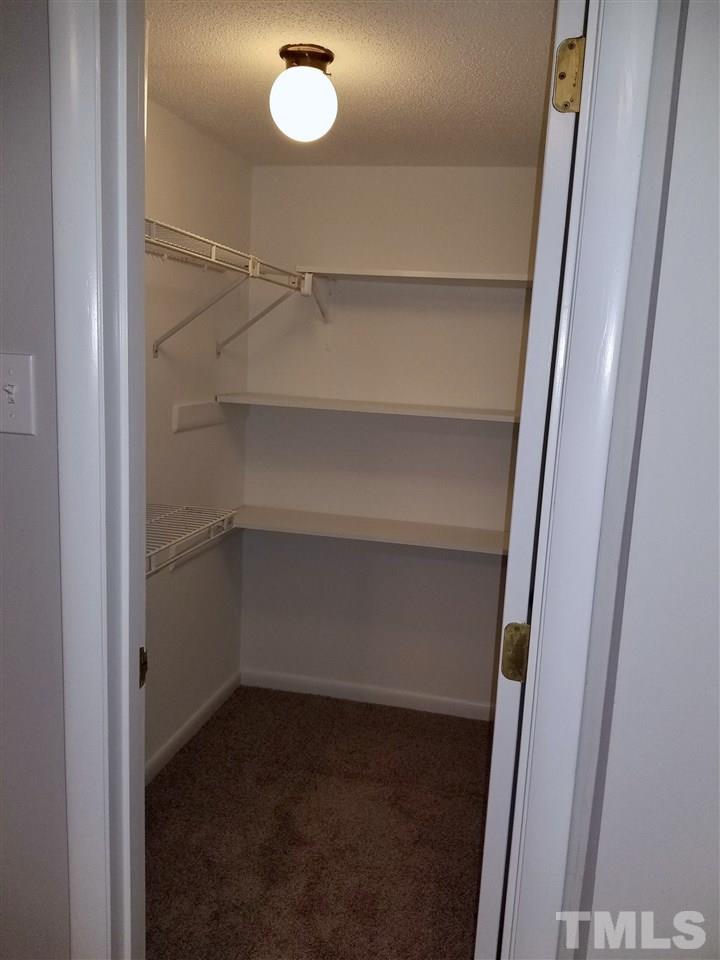 6420 Rockrest Court Raleigh, NC 27612 - Photo 15 of 22 Walk-in closet in basement bedroom